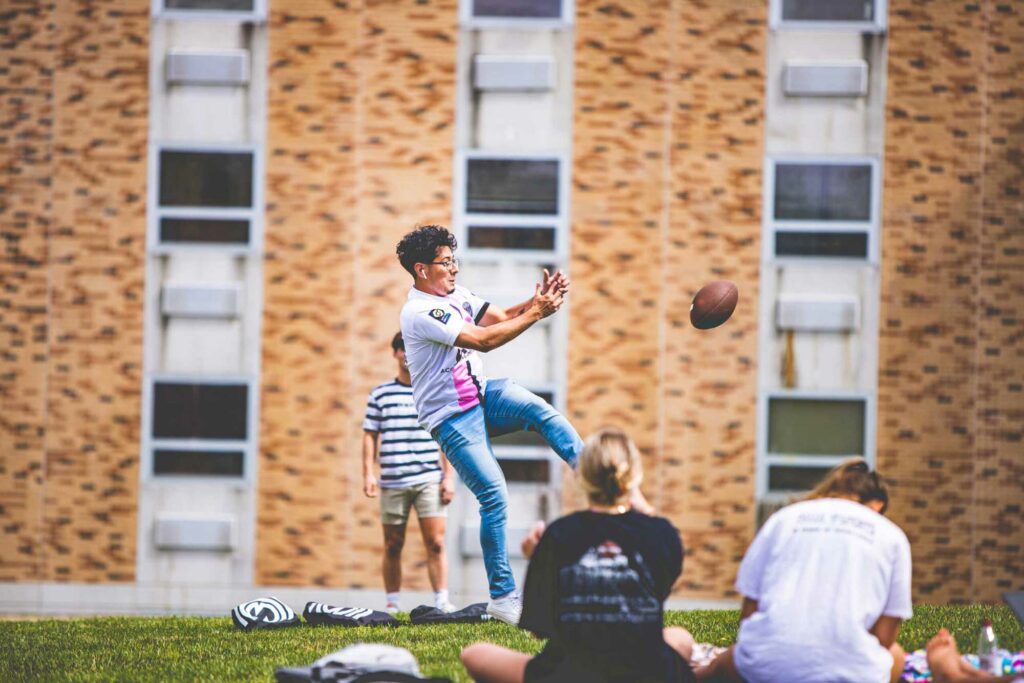 Student Catching Football