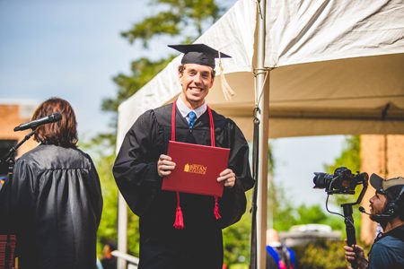 Grad with Diploma