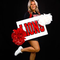 Cheerleader Holding Lions Sign